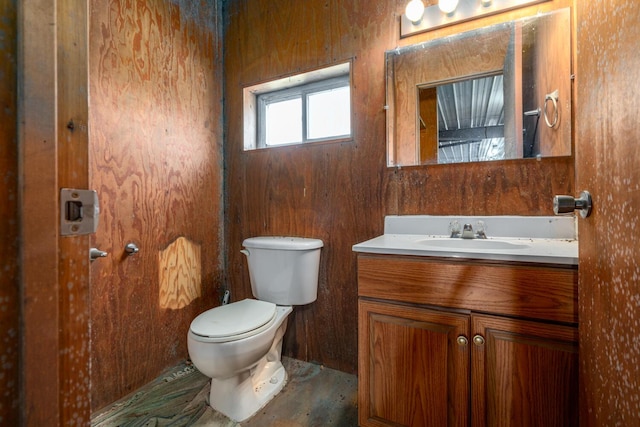 9363 S Grow Rd, Greenville, MI 48838 - half bath featuring vanity, toilet, and wooden walls