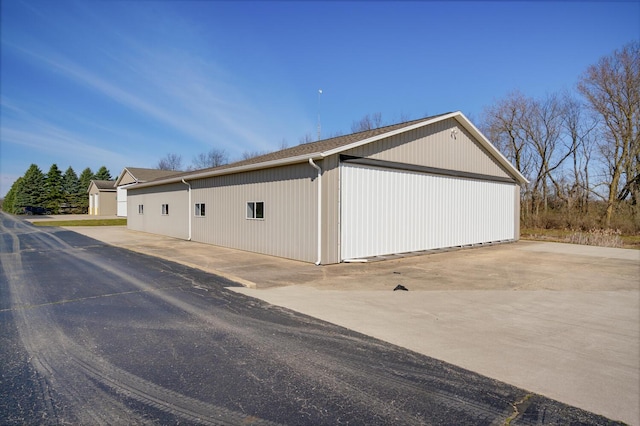 9363 S Grow Rd, Greenville, MI 48838 - view of home's exterior featuring an outbuilding