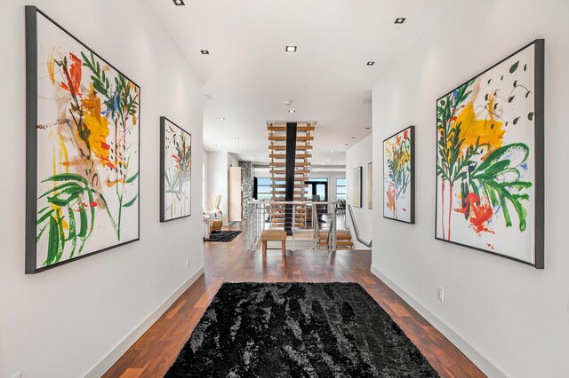 443 N Shore Dr, South Haven, MI 49090 - hall featuring wood finished floors, baseboards, stairway, and recessed lighting