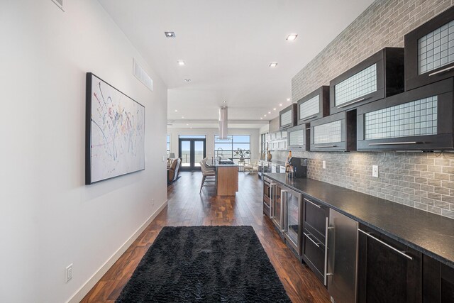 443 N Shore Dr, South Haven, MI 49090 - kitchen with dark countertops, dark wood-type flooring, backsplash, baseboards, and recessed lighting