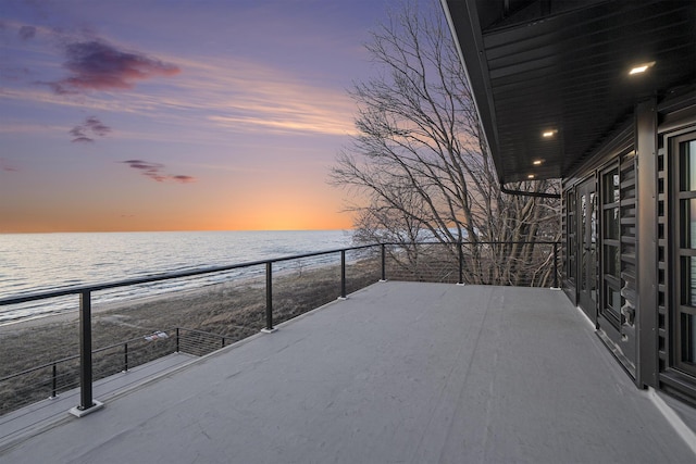 443 N Shore Dr, South Haven, MI 49090 - patio terrace at dusk with view of water and beach and a balcony