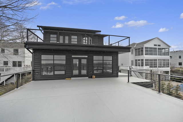 443 N Shore Dr, South Haven, MI 49090 - view of patio / terrace with a sunroom and french doors