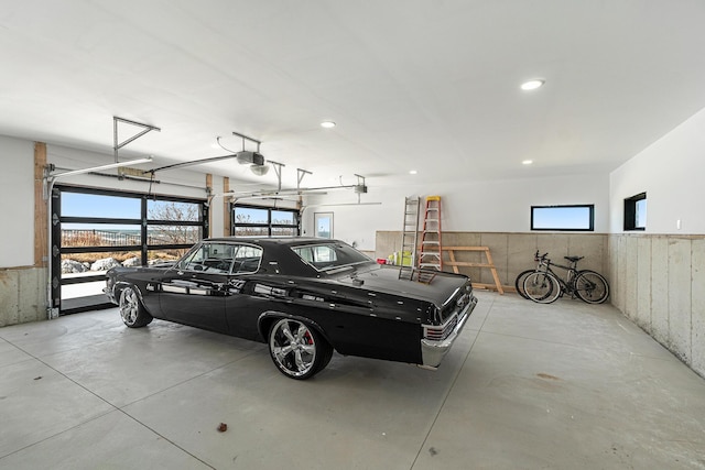443 N Shore Dr, South Haven, MI 49090 - garage with a garage door opener, wainscoting, and recessed lighting