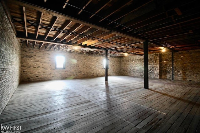 basement featuring hardwood / wood-style floors