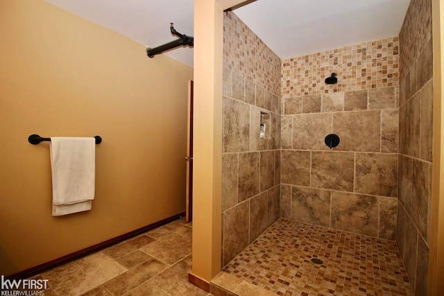 bathroom with tiled shower