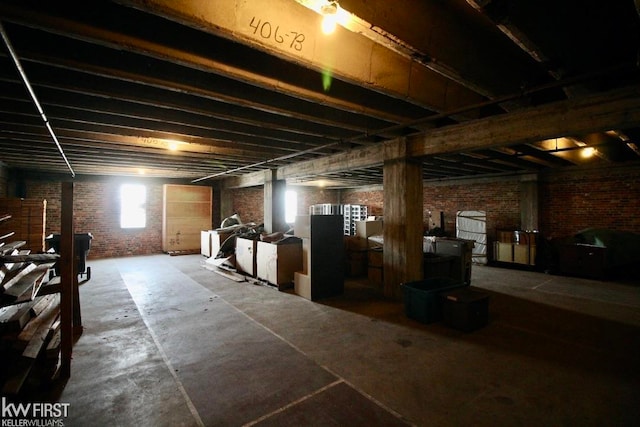 basement with brick wall