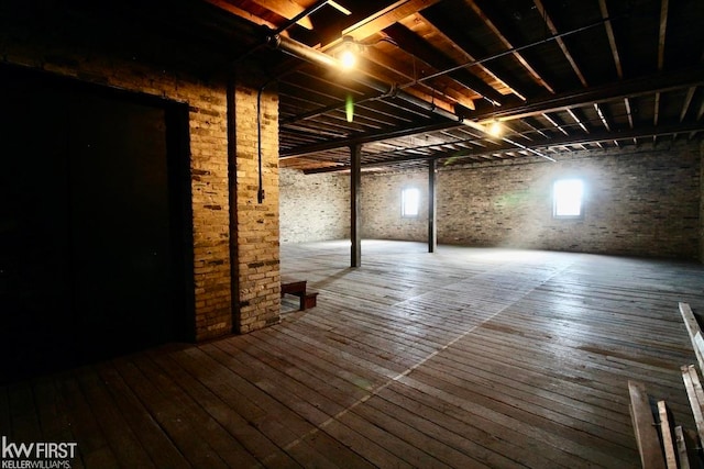 basement with hardwood / wood-style flooring