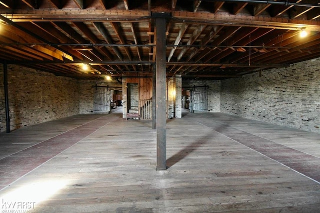 basement with hardwood / wood-style floors