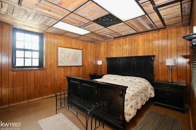 bedroom with wood ceiling and wooden walls