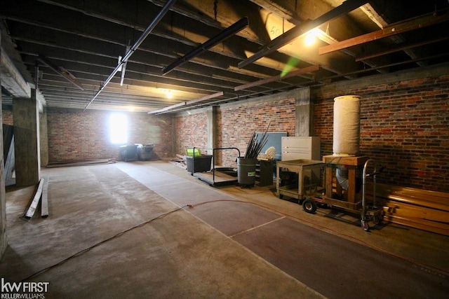 basement with brick wall