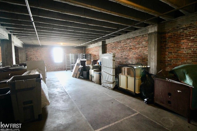 basement featuring brick wall