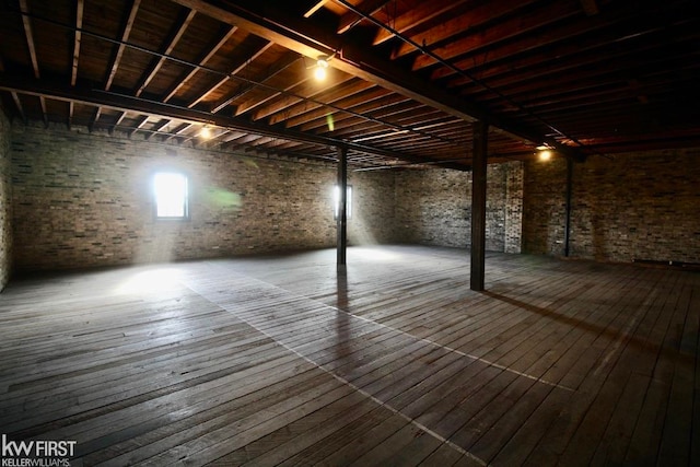 basement with hardwood / wood-style floors