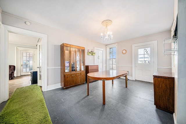 dining space featuring an inviting chandelier and ornamental molding