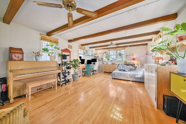 bedroom featuring beam ceiling and light hardwood / wood-style flooring