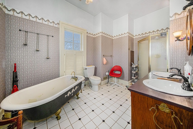 full bathroom with tile patterned floors, vanity, toilet, and separate shower and tub