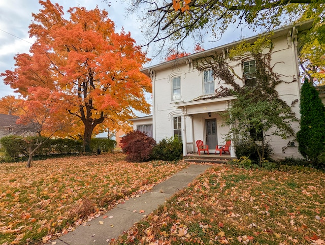 italianate-style house with covered porch