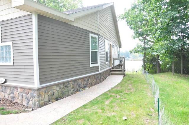 view of home's exterior with a yard