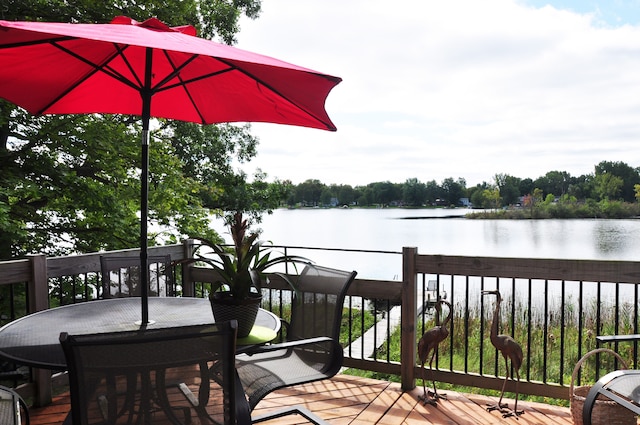 wooden deck featuring a water view