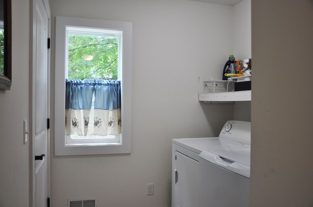 clothes washing area featuring washing machine and dryer