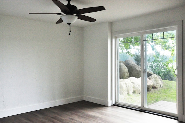 spare room with ceiling fan and wood-type flooring