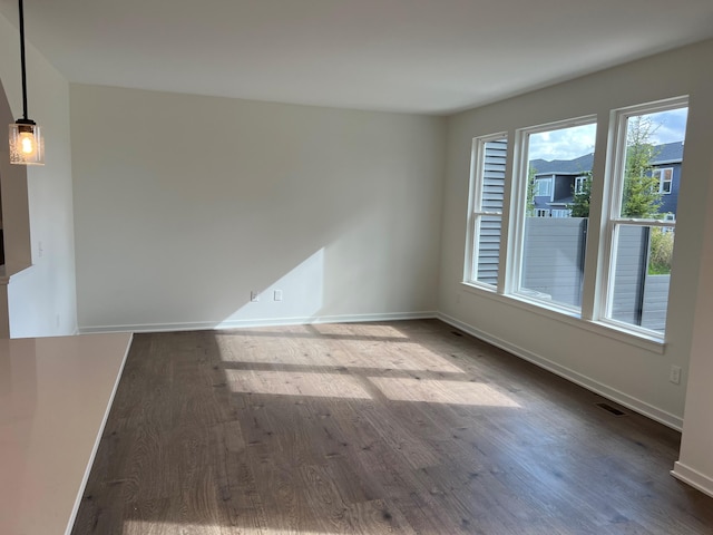 empty room featuring hardwood / wood-style flooring