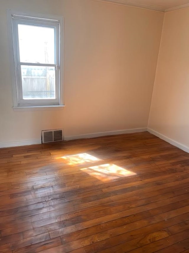 unfurnished room featuring dark hardwood / wood-style flooring