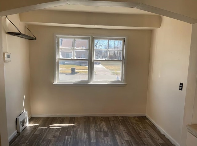 unfurnished room featuring dark hardwood / wood-style flooring