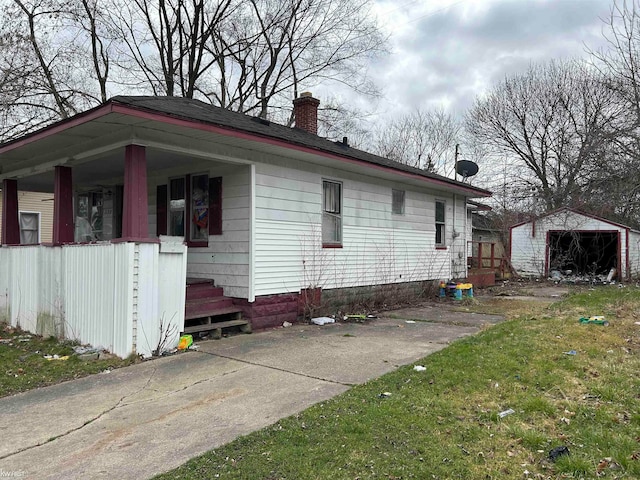 view of home's exterior featuring an outbuilding and a yard