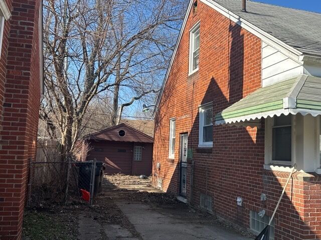 view of property exterior with an outdoor structure