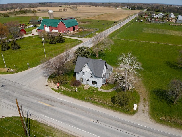 birds eye view of property featuring a rural view