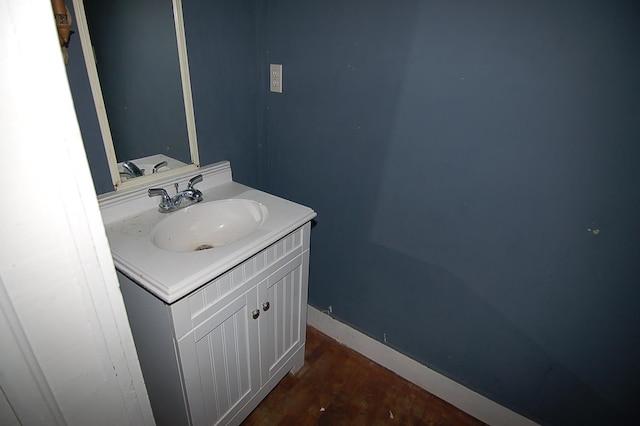 bathroom with hardwood / wood-style floors and vanity