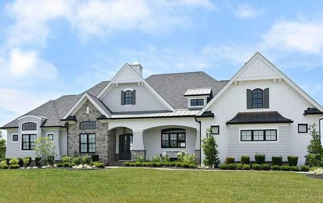 view of front facade with a porch and a front yard