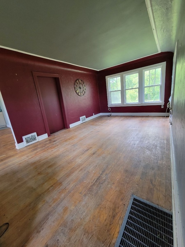 spare room with hardwood / wood-style floors