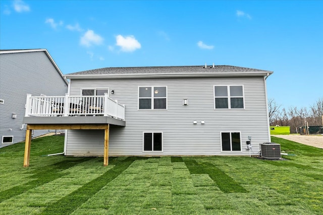 362 Jubilee Dr, Whitmore Lake, MI 48189 - back of property with central AC, a deck, and a yard