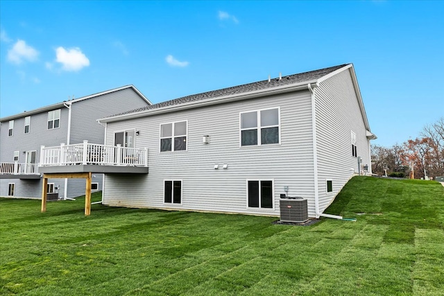 362 Jubilee Dr, Whitmore Lake, MI 48189 - rear view of property with central AC unit, a yard, and a wooden deck