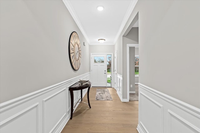 362 Jubilee Dr, Whitmore Lake, MI 48189 - entryway with crown molding, a wainscoted wall, light wood-type flooring, and a decorative wall