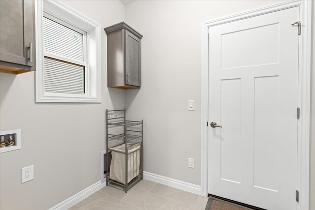 362 Jubilee Dr, Whitmore Lake, MI 48189 - laundry area with baseboards, hookup for a washing machine, cabinet space, and light tile patterned floors