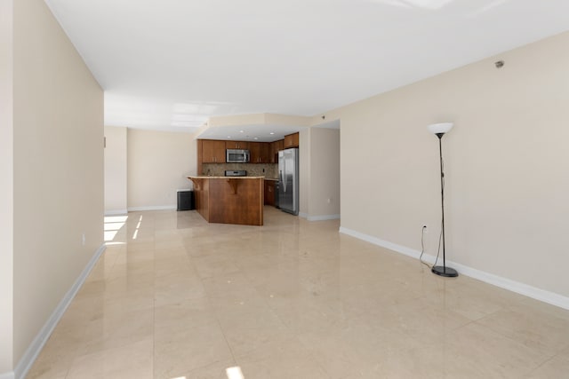 unfurnished living room featuring light tile patterned flooring