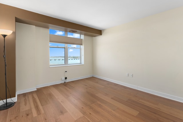 spare room featuring light wood-type flooring