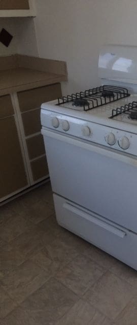 interior space featuring white gas range oven