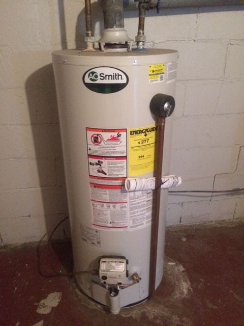 utility room featuring gas water heater