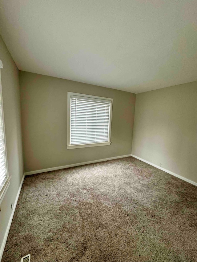 spare room with carpet flooring