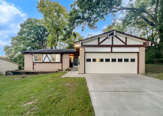 view of front of property with a garage and a front lawn