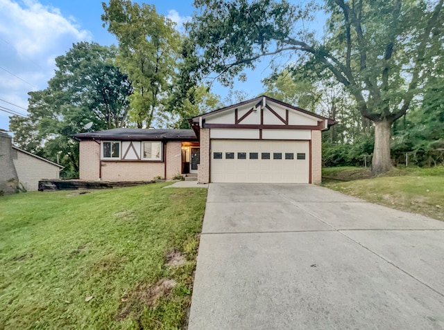 view of front of house with a garage and a front lawn