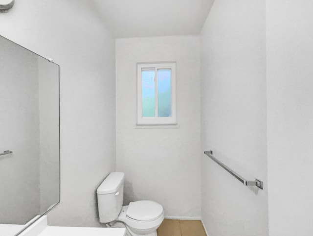 bathroom with tile patterned floors and toilet