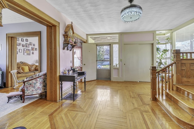 entryway featuring light parquet flooring