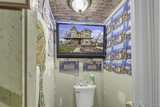 bathroom with brick ceiling