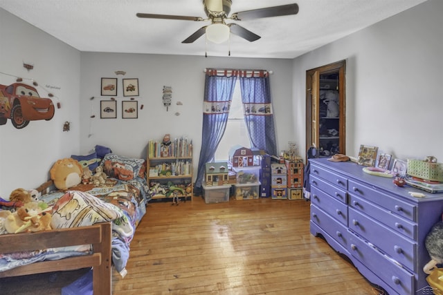 bedroom featuring light hardwood / wood-style floors and ceiling fan