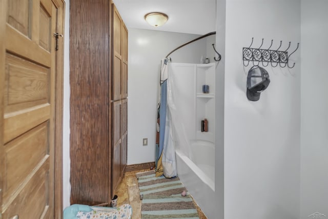 bathroom with shower / tub combo with curtain