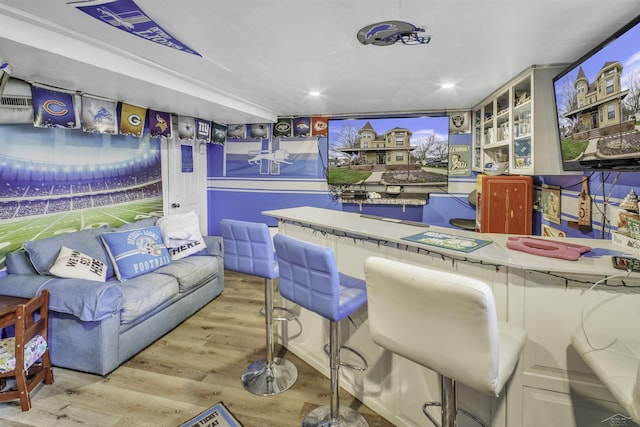 recreation room with light hardwood / wood-style flooring